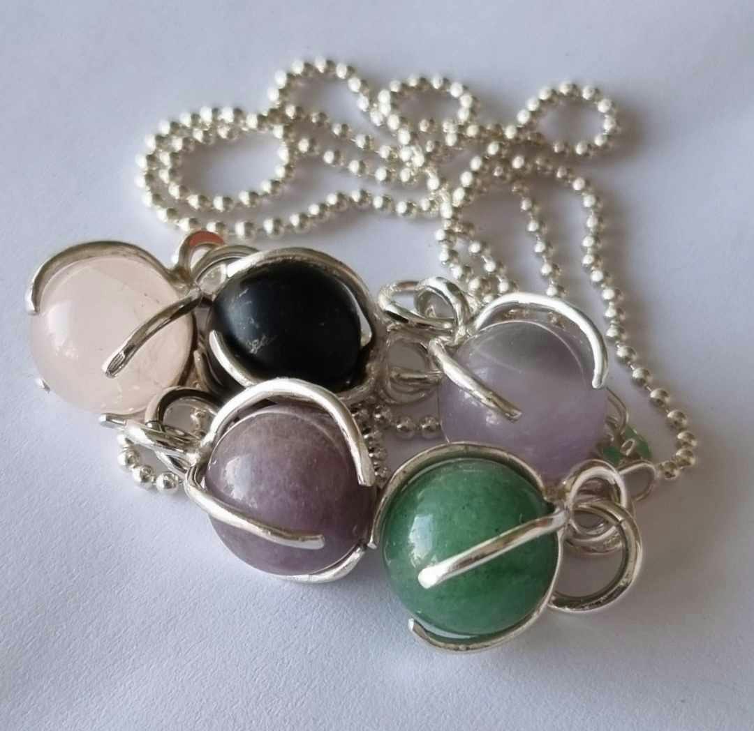 A nice necklace with a purple stone, round, set in sterling silver