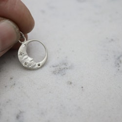 "Mångubbe" i silver med diamantstjärnor