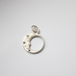 "Mångubbe" i silver med diamantstjärnor
