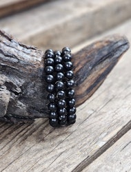 Jet (Fossilerad kolmineral), armband 8mm runda pärlor -30% fyndexemplar trasig pärla