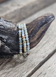 Blå/Brun Onyx, armband 5-6mm runda pärlor