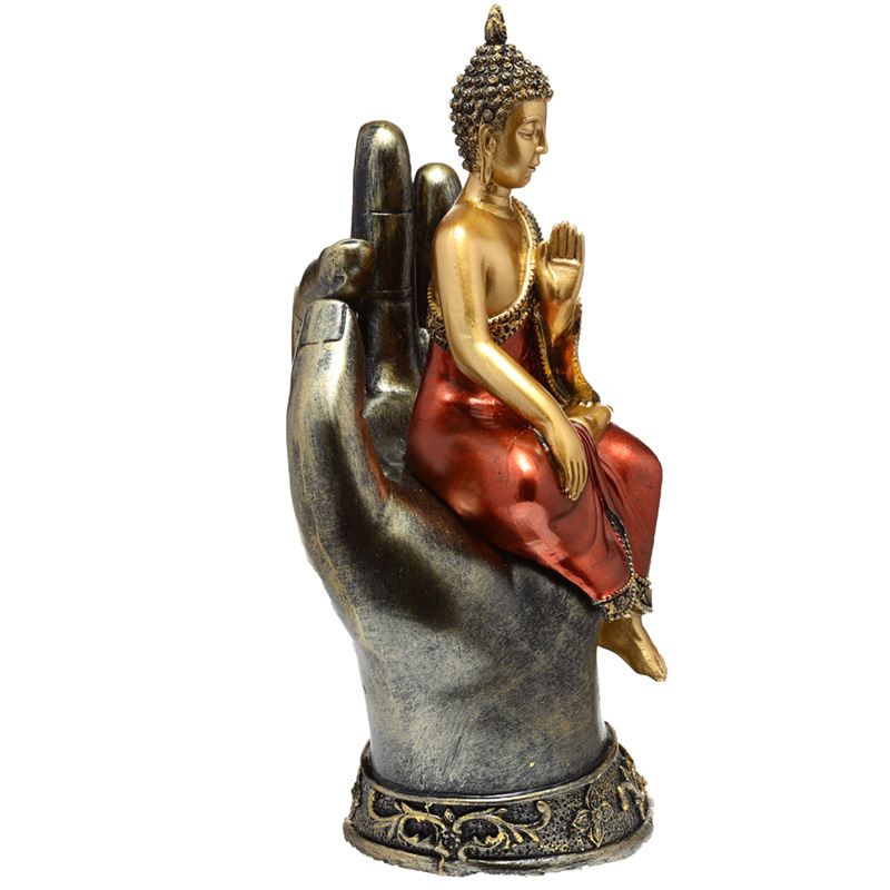 Sittande Thai Buddha i hand i Guld och Rött