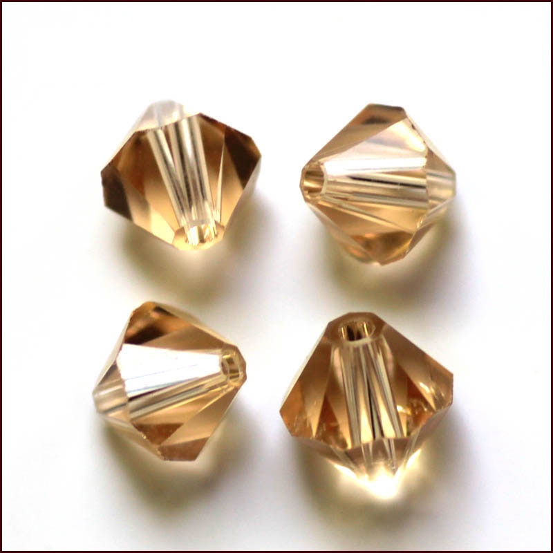 Lyxiga fasetterade Bicon glaspärlor - Klass AAA - guld gul - 10-p -6x6mm