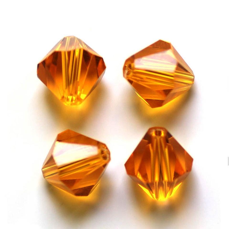 Lyxiga fasetterade Bicon glaspärlor - Klass AAA - gul orange - 10-p -6x6mm