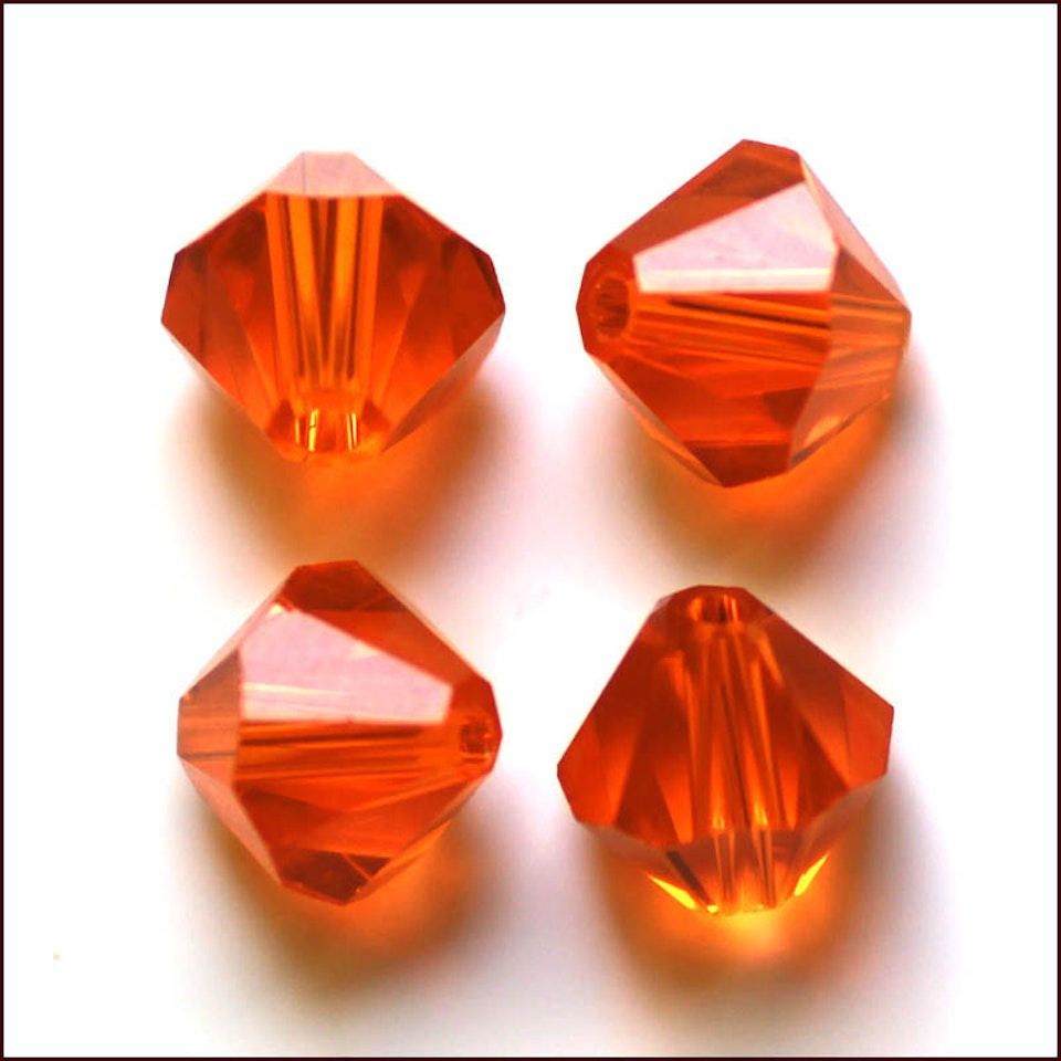 Lyxiga fasetterade Bicon glaspärlor - Klass AAA - orange - 10-p -6x6mm