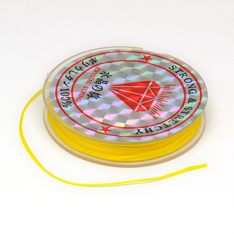 Färgad Elastisk nylontråd på rulle 0,6mm Gul