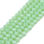 Facetterad glaspärla rondell - 4x3mm - ljus grön  - sträng - ca 130st
