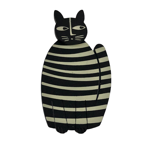Stor svartvit randig kattbrosch i plexiglas