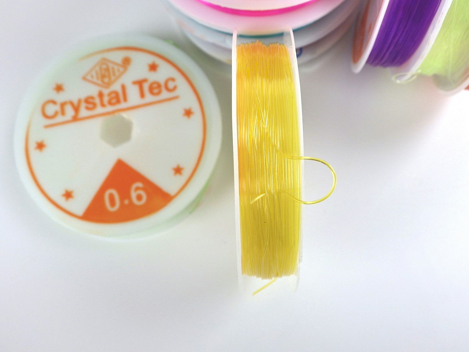 Elastisk tråd 10 m Crystal Tec 0,6 mm färg