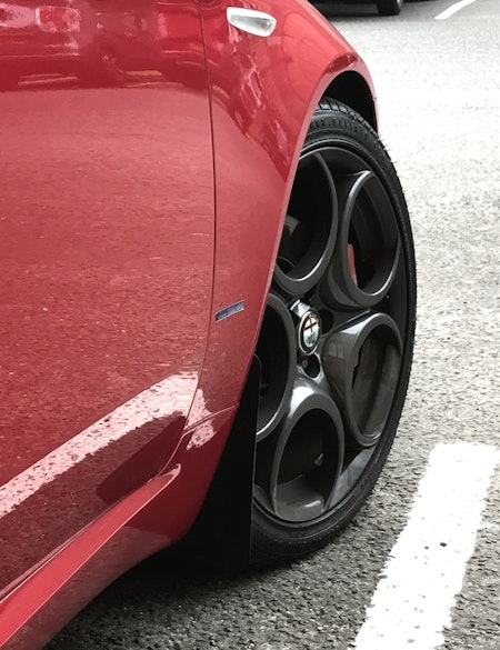 Alfa romeo wheels with black mudflaps mounted