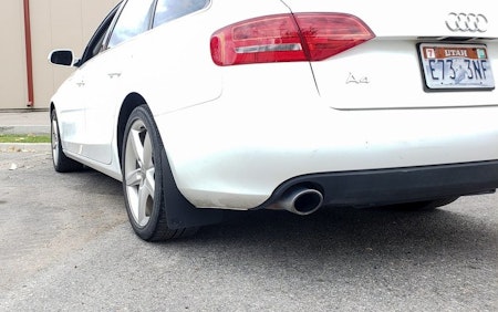 Styling for audi a4. Black mud flaps on white audi