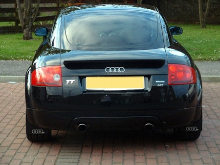 Black Audi TT with black mud flaps