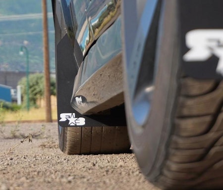 Black mud flaps with white logos for Dodge Caliber