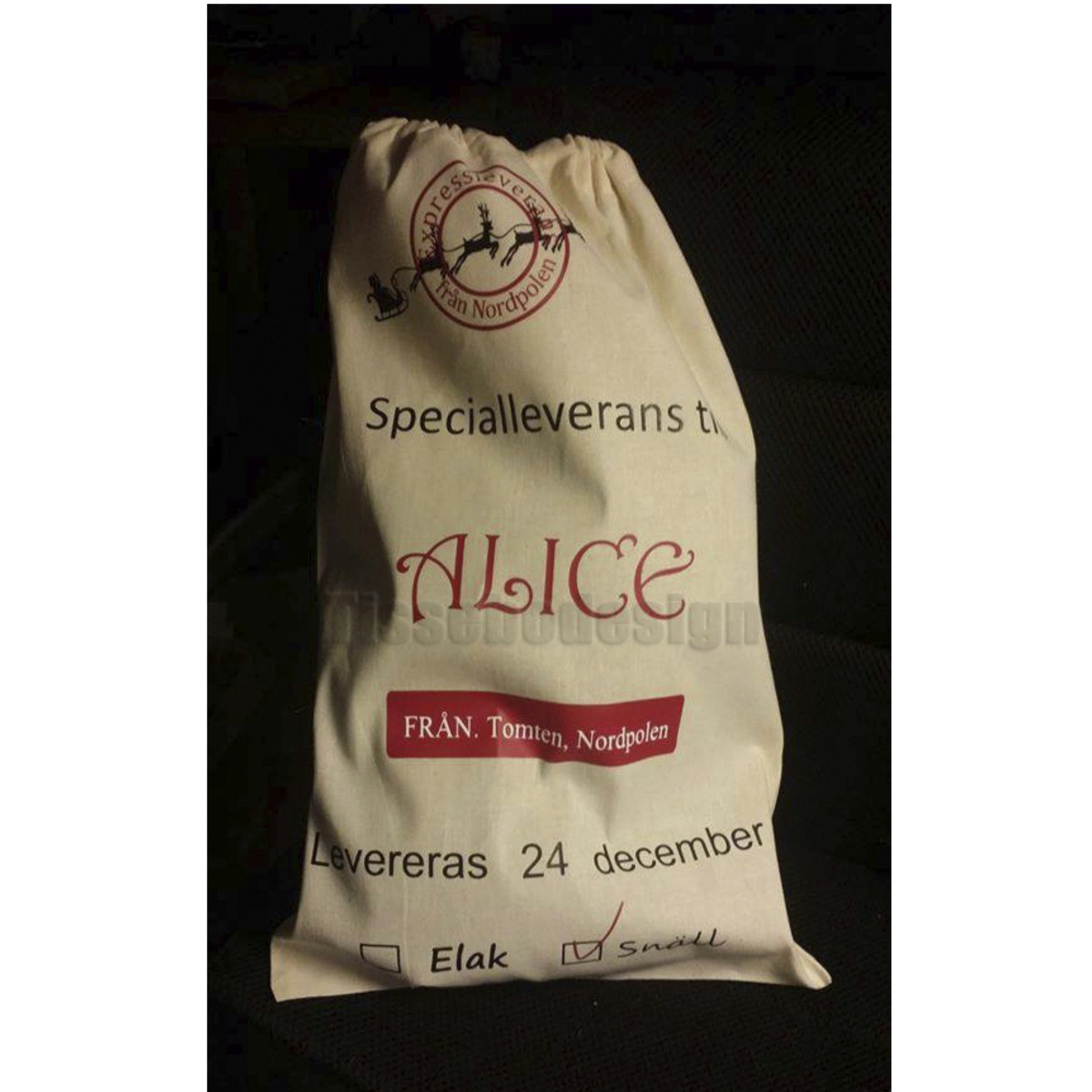 Naturvit julsäck med dragskostängning och personlig text, tillgänglig i olika storlekar från Small till XL.