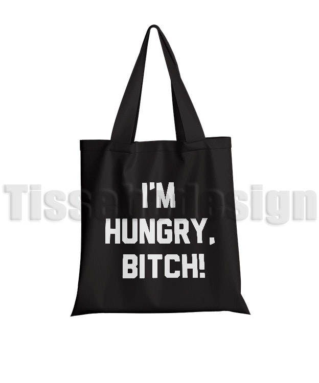 Bilden visar en svart tygväska med Tryck I´m Hungry Bitch i vit text