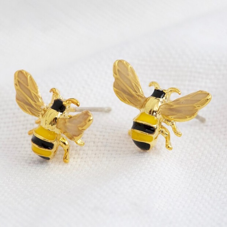 Bild på örhängen med emaljerade bin.