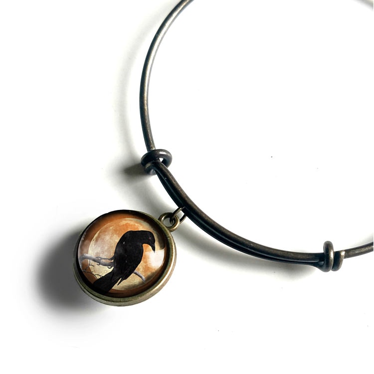 Armband – Kråkfågel, orange måne