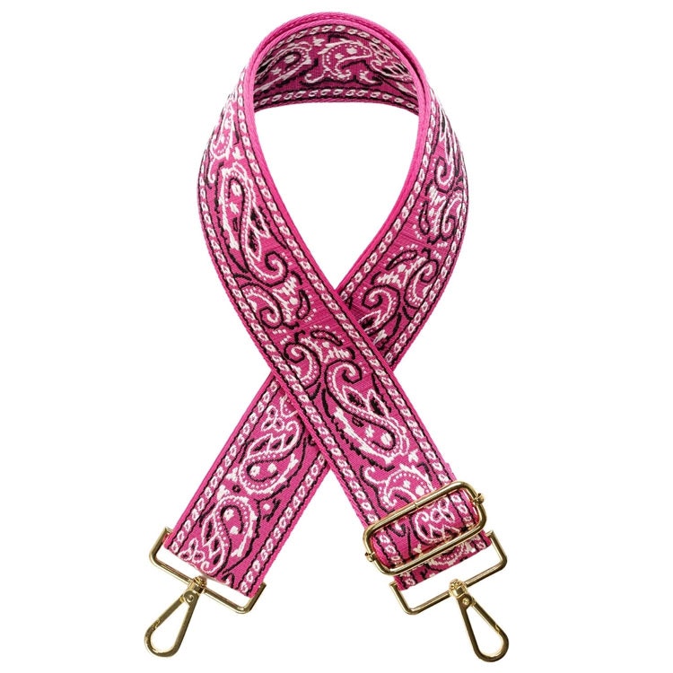 Bild som visar en rosa axelrem med orientaliskt mönster i svart och vitt.