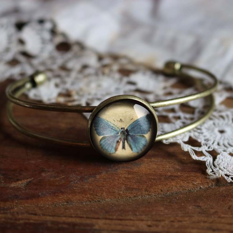 Manschettarmband – Blå fjäril