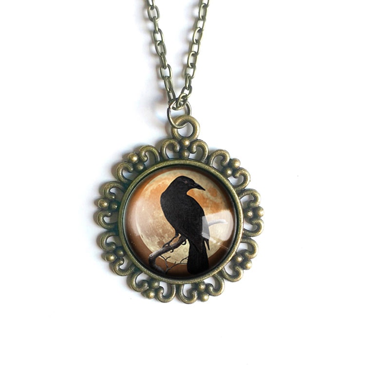 Halsband, stor berlock – Kråkfågel, orange måne