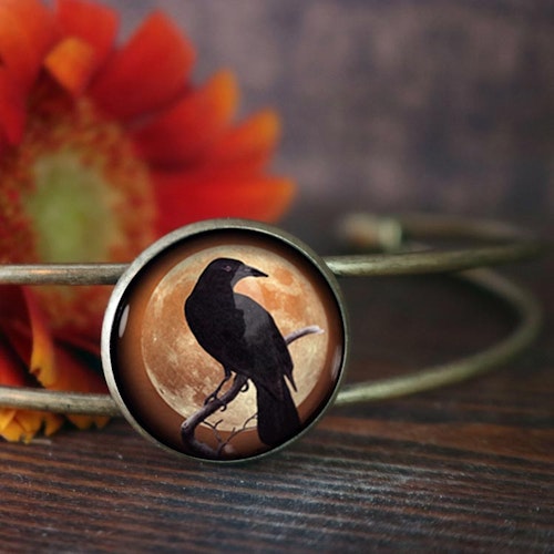 Manschettarmband – Kråkfågel, orange måne