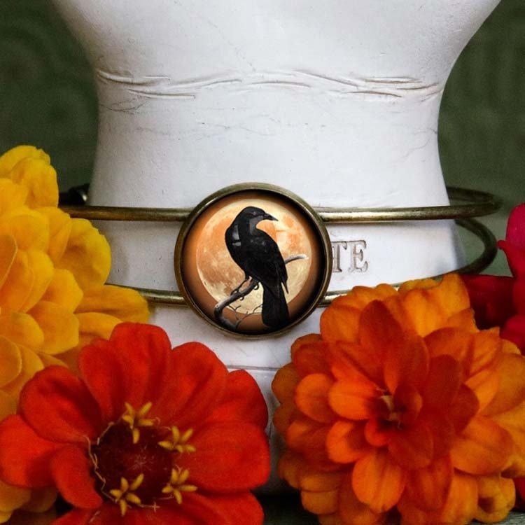 Manschettarmband – Kråkfågel, orange måne