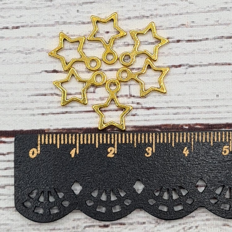 Berlock, Stjärna Guld, 1,4 cm. 10st.