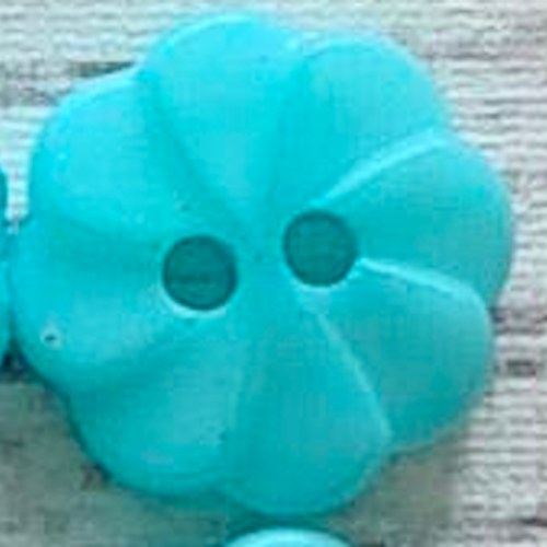 Blomma Ljusblå. 1,3 cm.