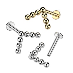 Labret / flat back piercing i titanium 1,2mm med V-formad bollkluster