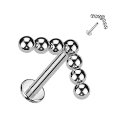 Labret / flat back piercing i titanium 1,2mm med V-formad bollkluster