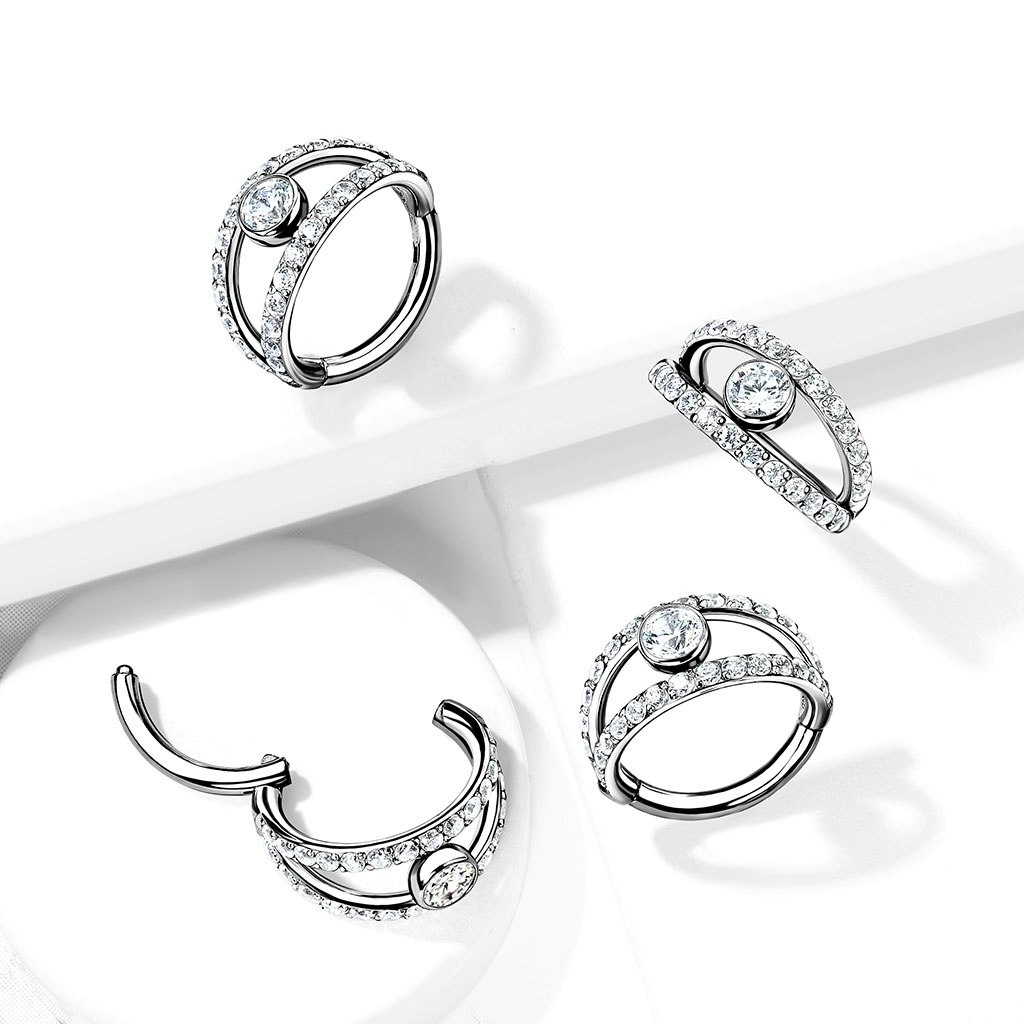 Clicker ring i kirurgiskt stål 1,2mm - centrerad kubisk zirconia och dubbel crystalklädd hoop