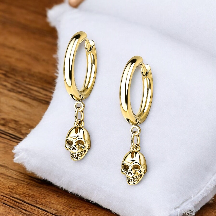 Gold PVD-plated surgical steel huggie with skull (sold in pairs)