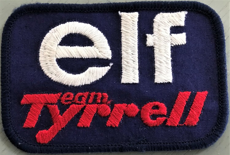 Tygmärke: Elf Team Tyrrell - Ronnies F1-stall 1977, format 7x10 cm