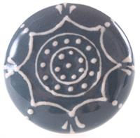 Blå keramikknopp med vita mönster.