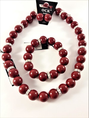 Halsband med röda kulor och strass med matchande armband och örhängen