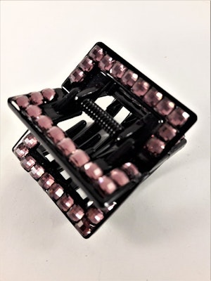 Svart hårklämma med rosa detaljer