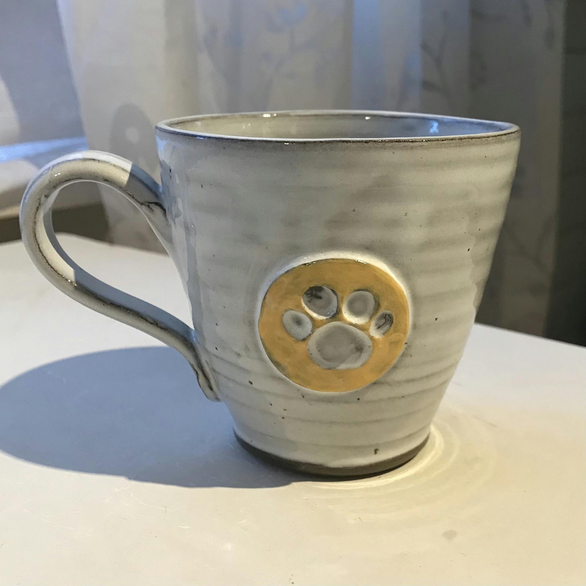 Kaffemugg med tassavtryck, gul