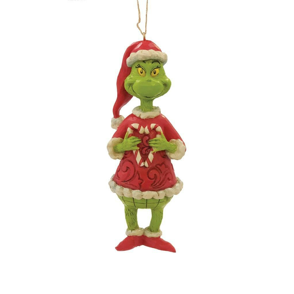 Grinch holding heart shaped candy
