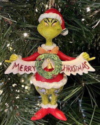 Grinch Holding Merry Christmas Banner (Hanging Ornament)