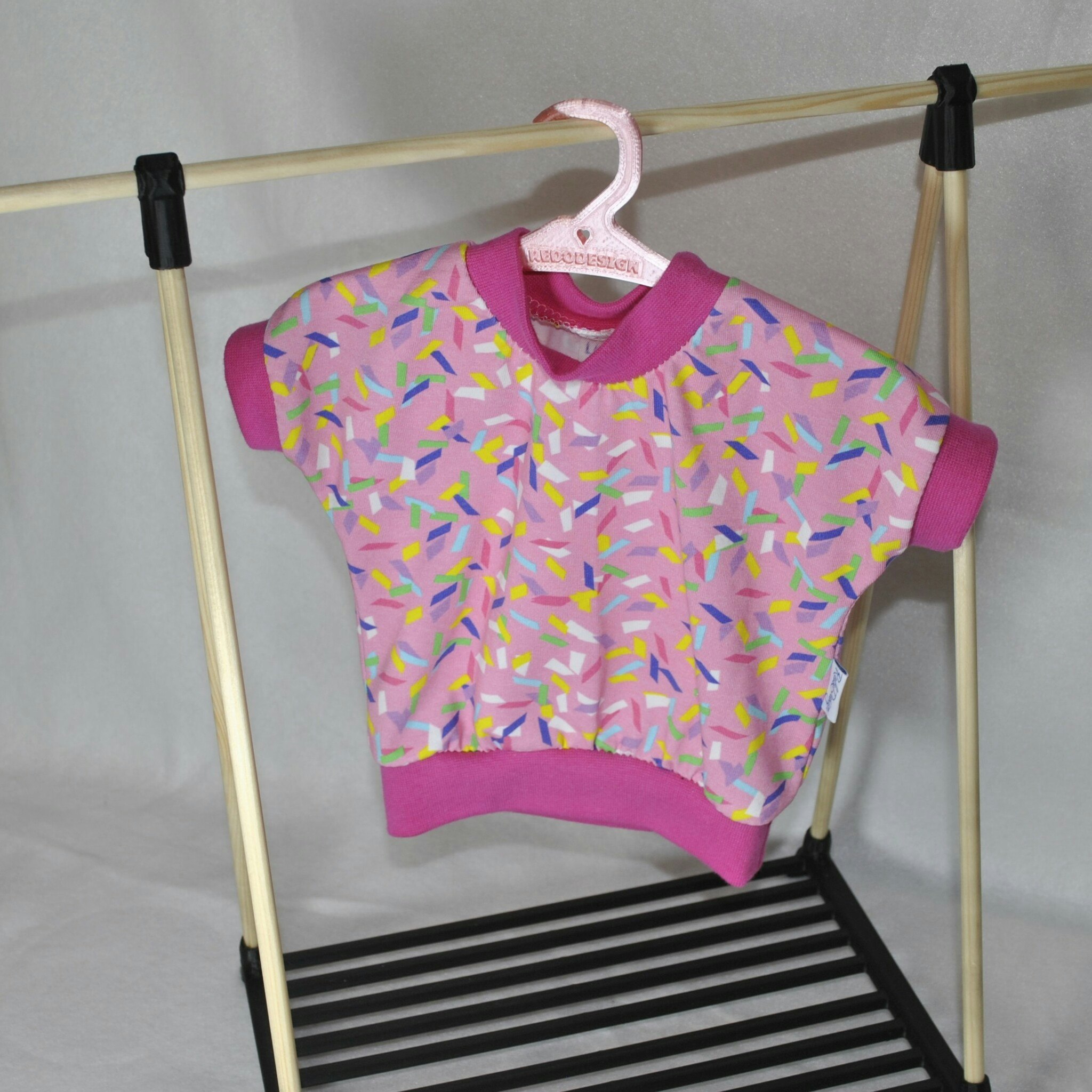 Dock - Rosa tröja med strössel stl 43-45 cm