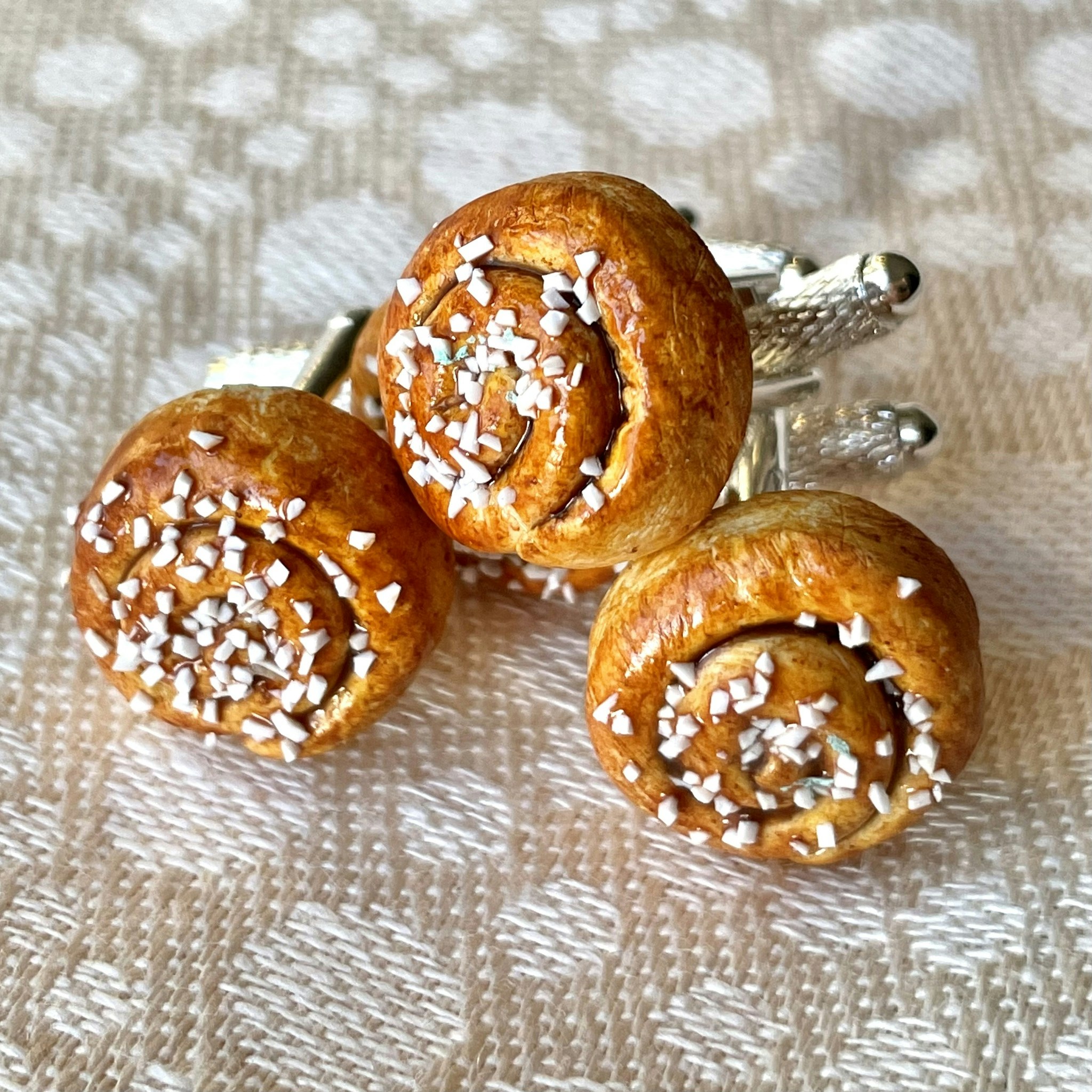 Kanelbulle manschettknappar