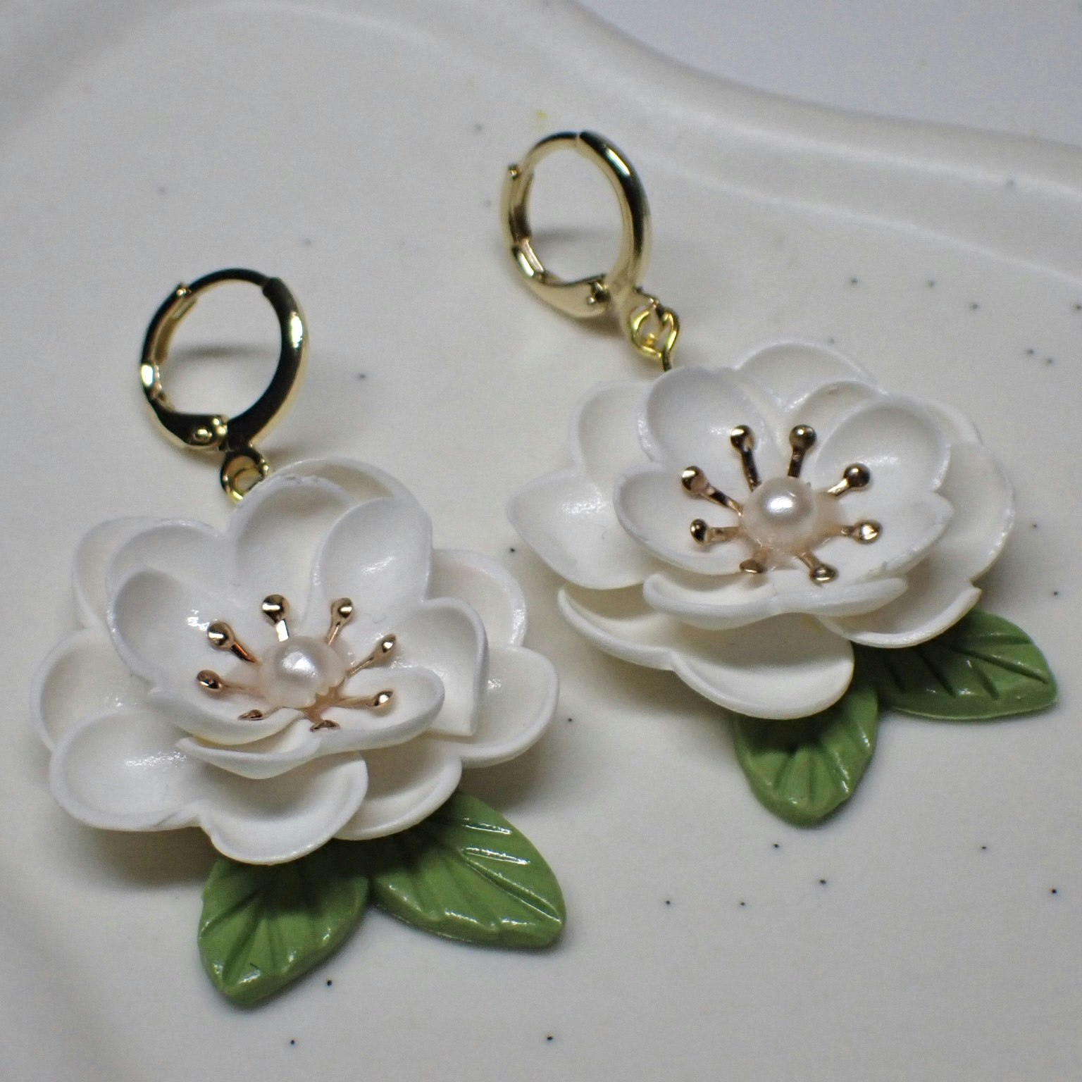 Magnolia vita guld/silver