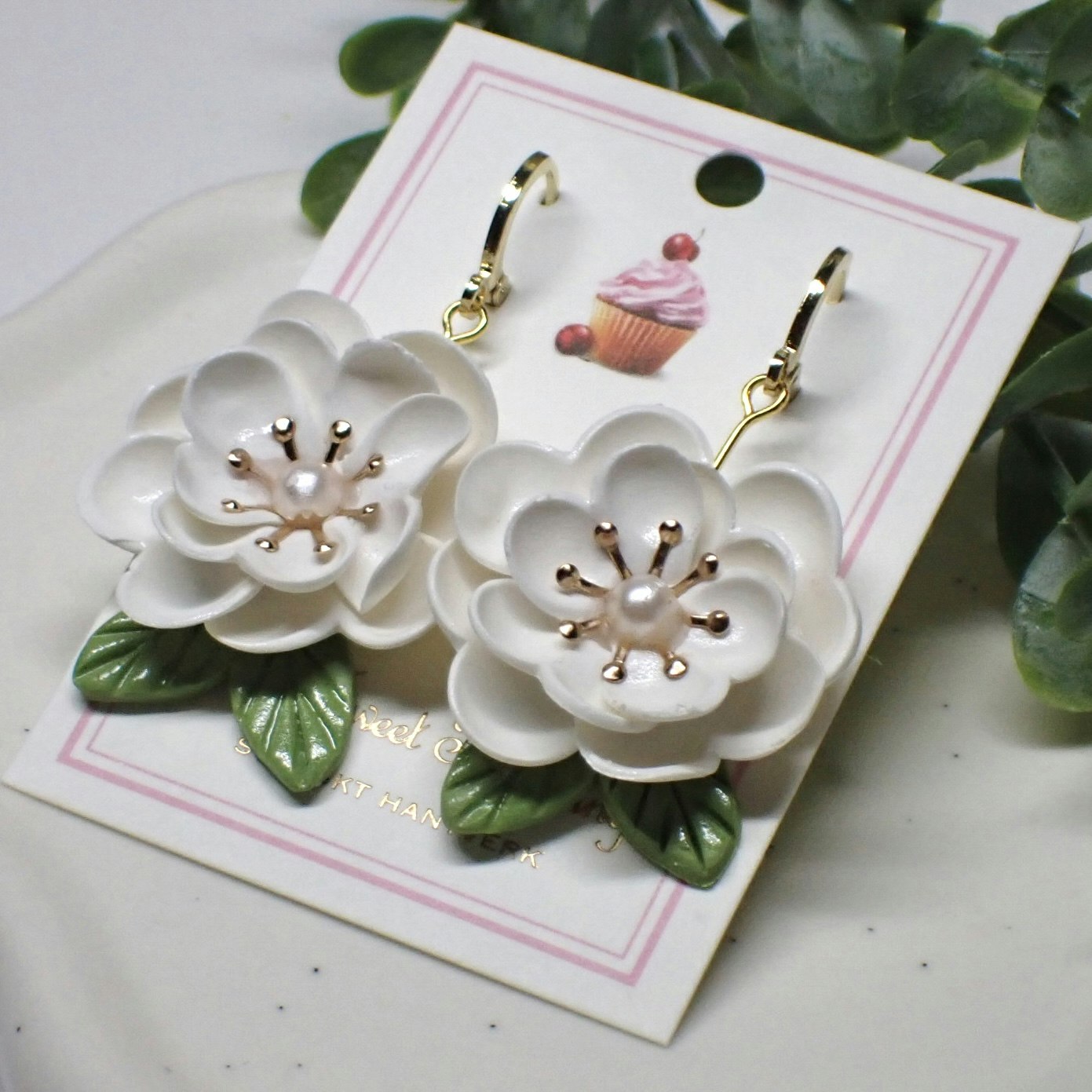 Magnolia vita guld/silver
