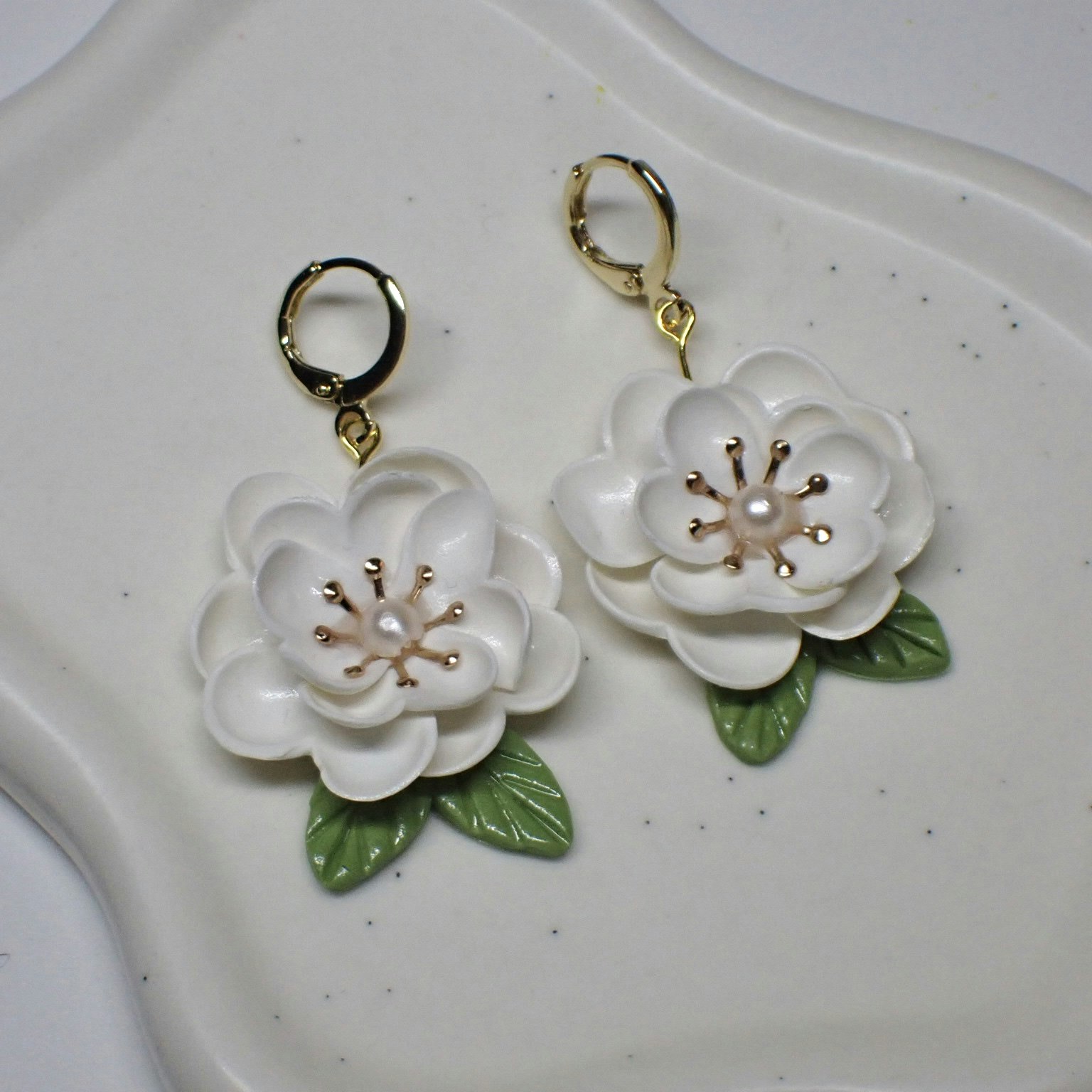 Magnolia vita guld/silver