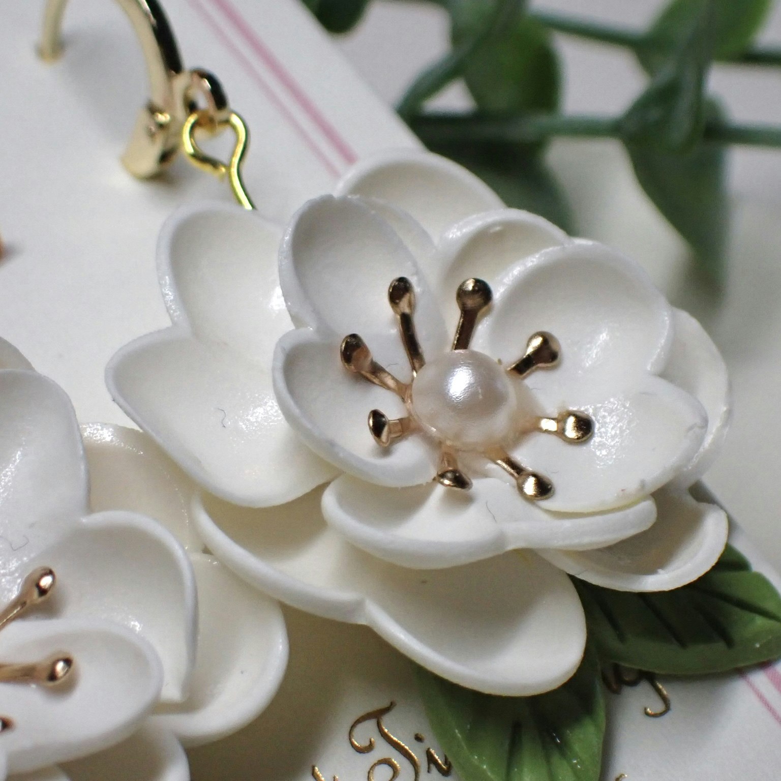 Magnolia vita guld/silver