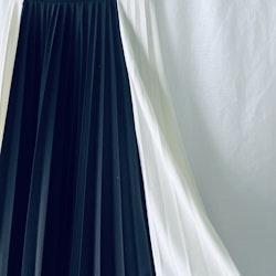 Plisserad svart/vit kjol