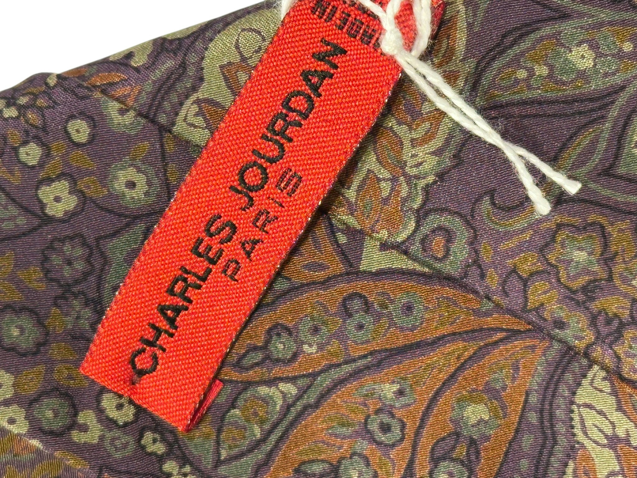 Charles Jourdan slips i siden