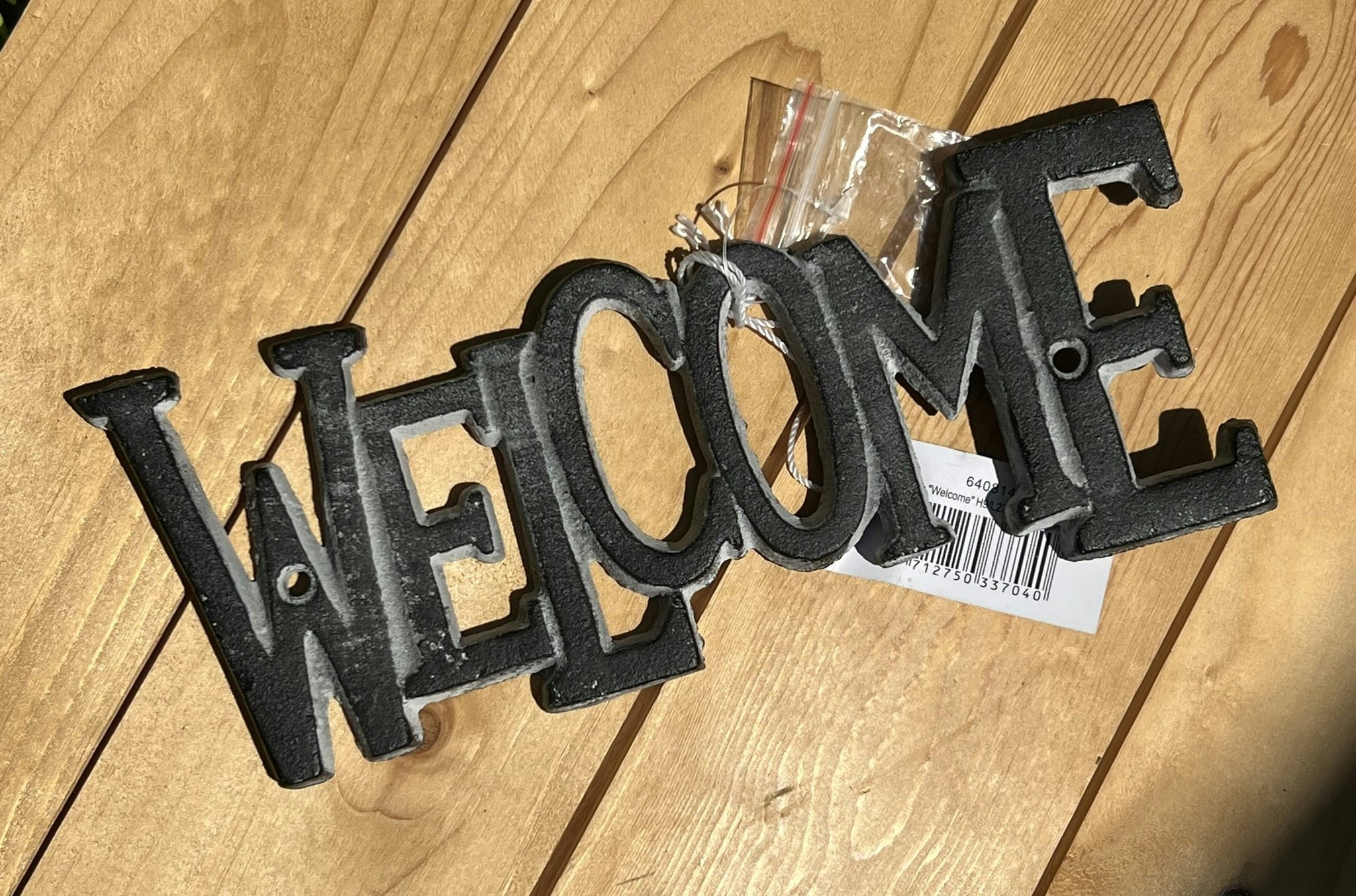 Skylt "WELCOME"