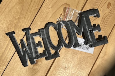 Skylt "WELCOME"