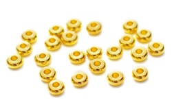 Guldfärgade rondeller 5 mm, ca 100 st